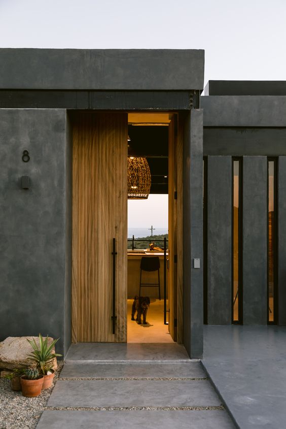 Puerta de entrada doble de madera simple y moderna